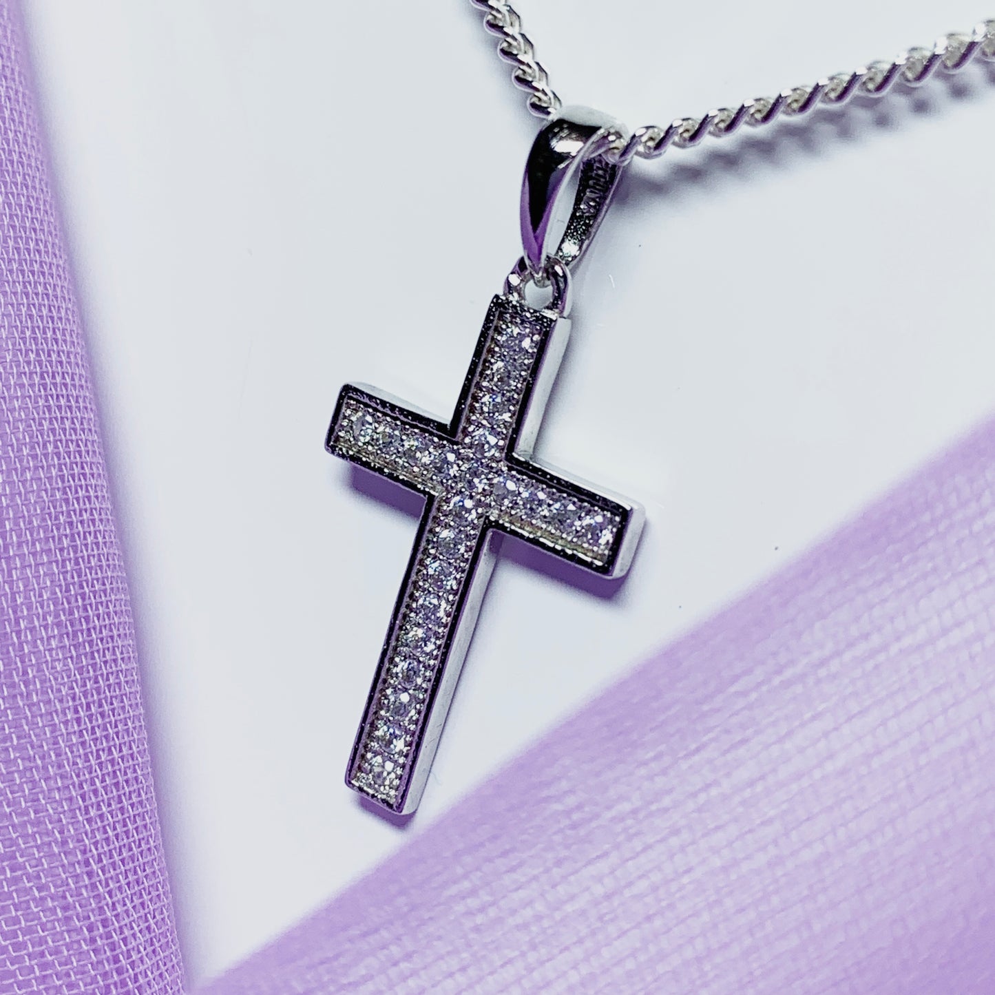 Cubic zirconia set cross including chain sterling silver