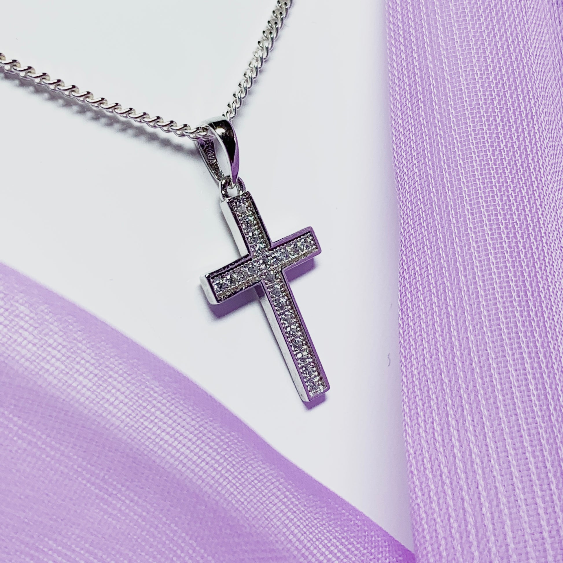 Cubic zirconia set cross including chain sterling silver