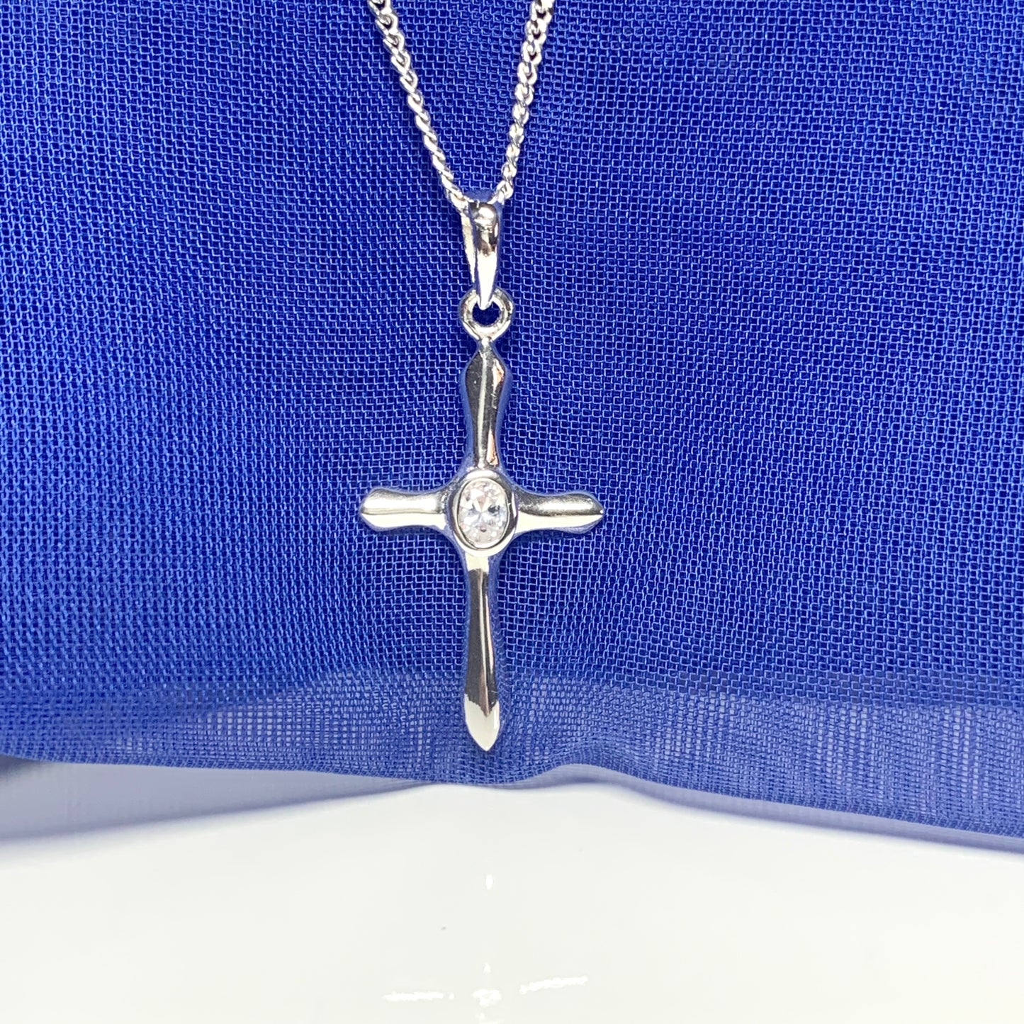 Cubic zirconia stone set cross including chain sterling silver