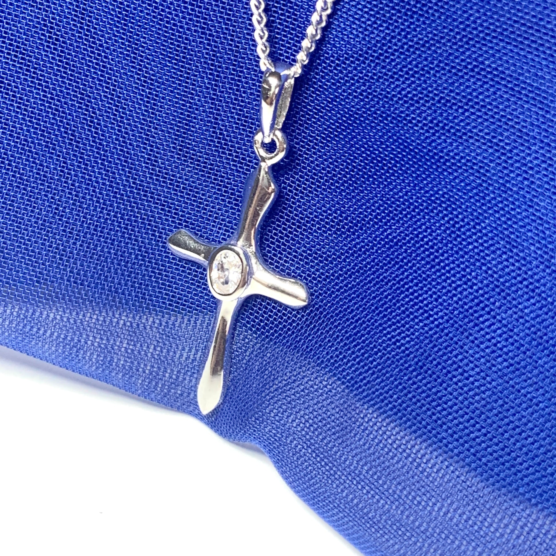 Cubic zirconia stone set cross including chain sterling silver