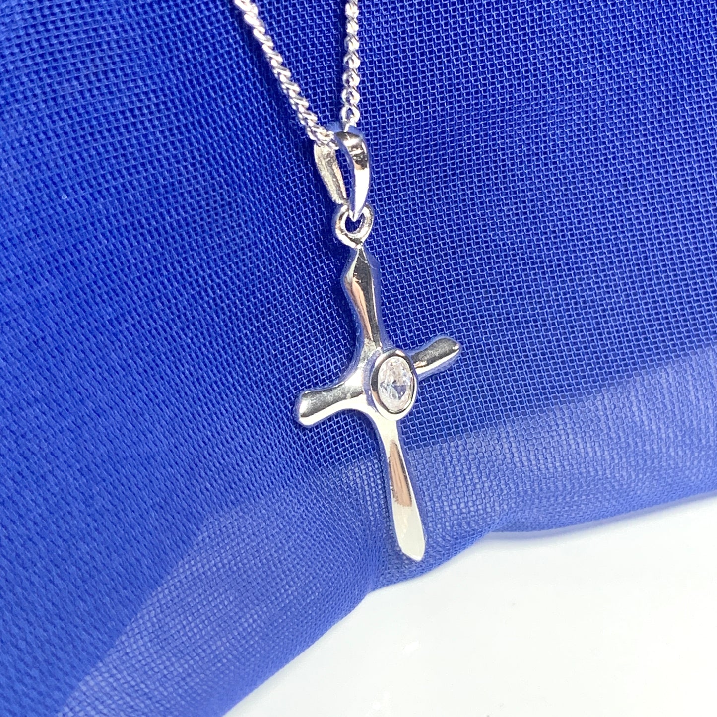 Cubic zirconia stone set cross including chain sterling silver