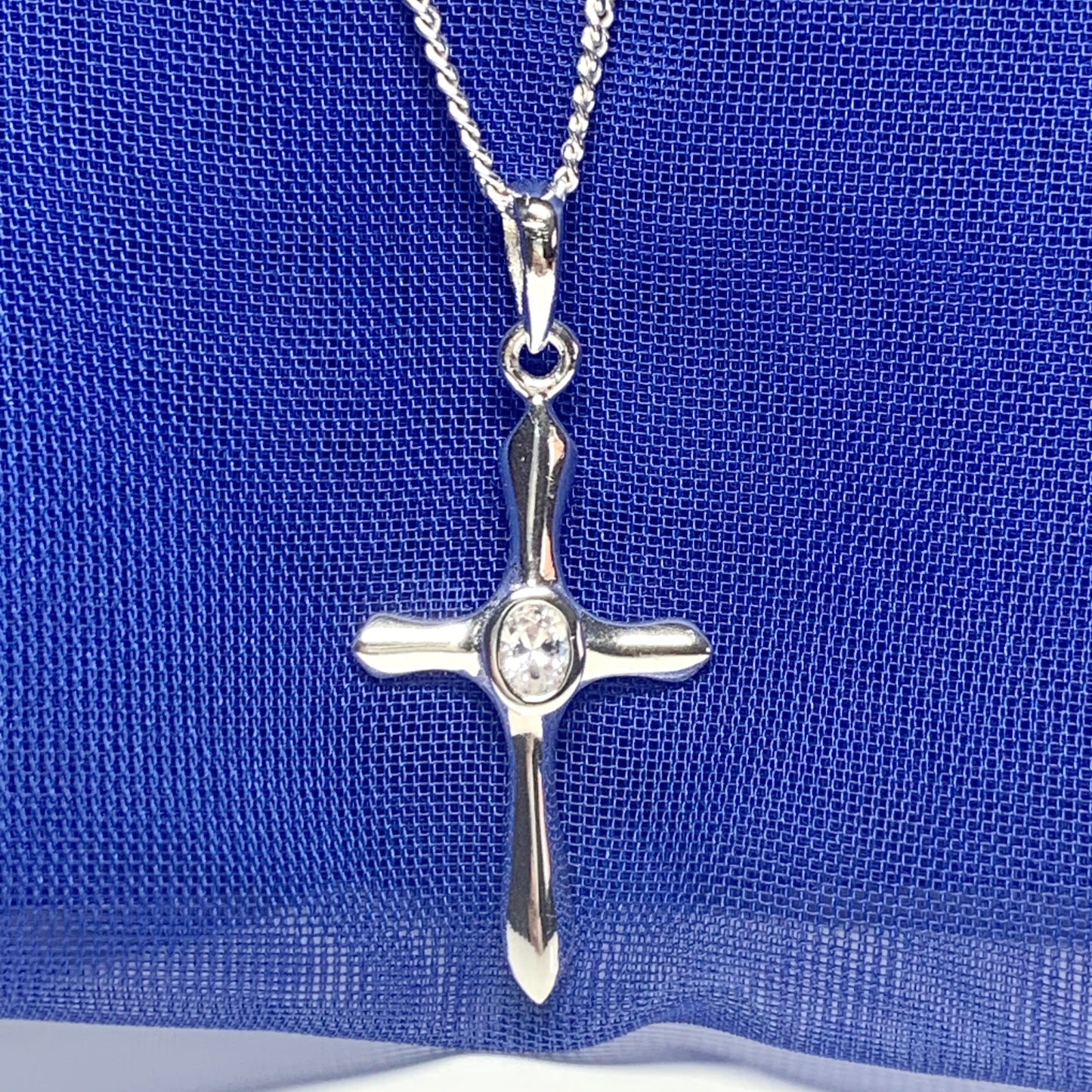 Cubic zirconia stone set cross including chain sterling silver