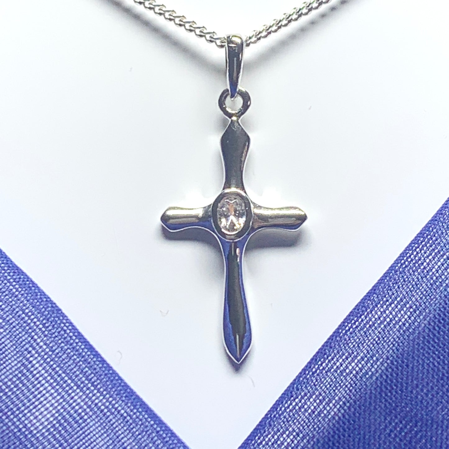 Cubic zirconia stone set cross including chain sterling silver