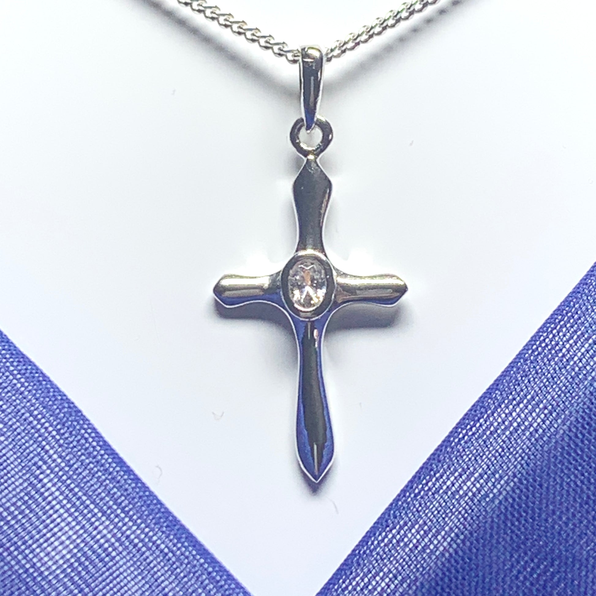 Cubic zirconia stone set cross including chain sterling silver