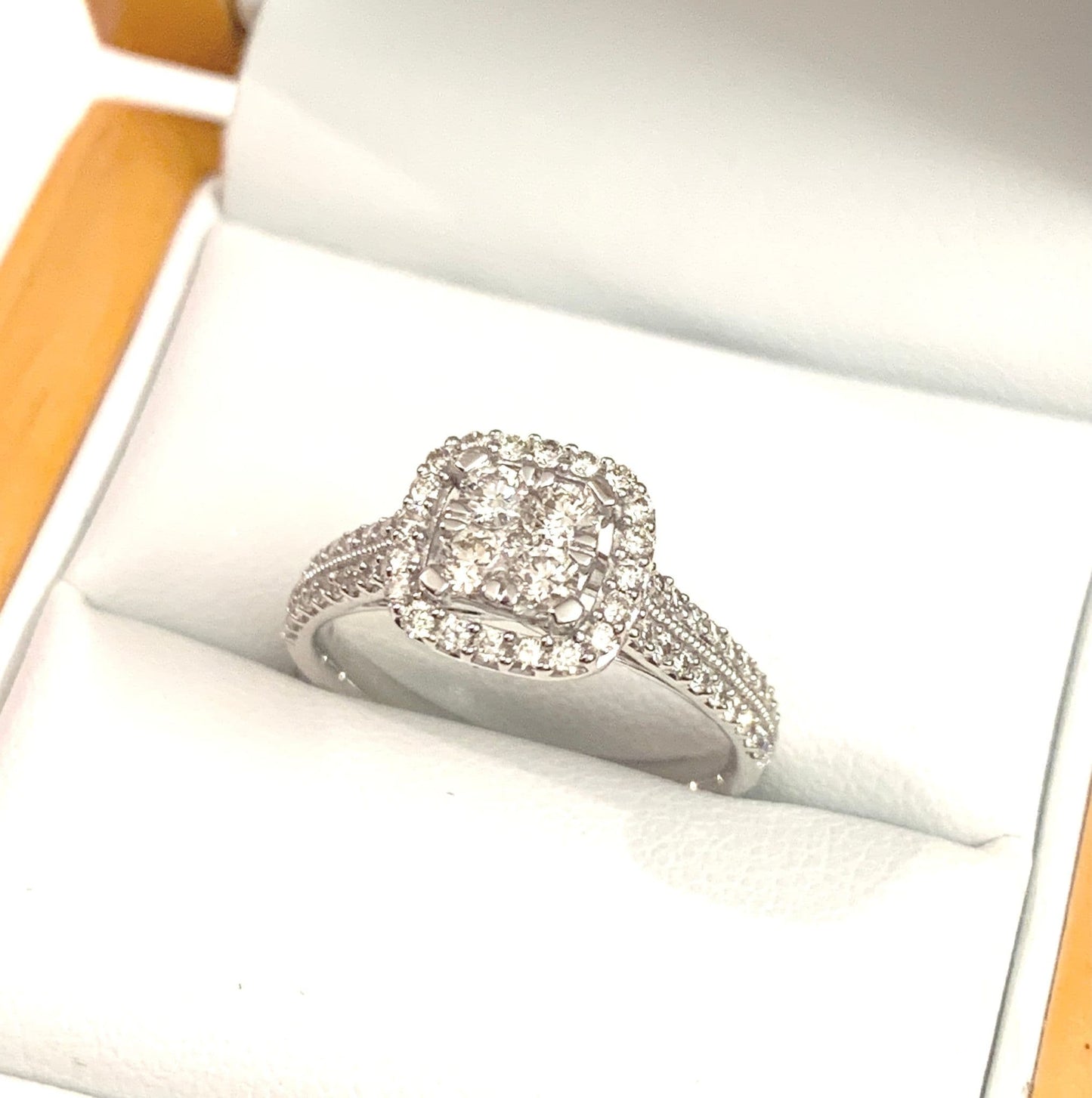 Cushion shaped diamond cluster ring engagement white gold