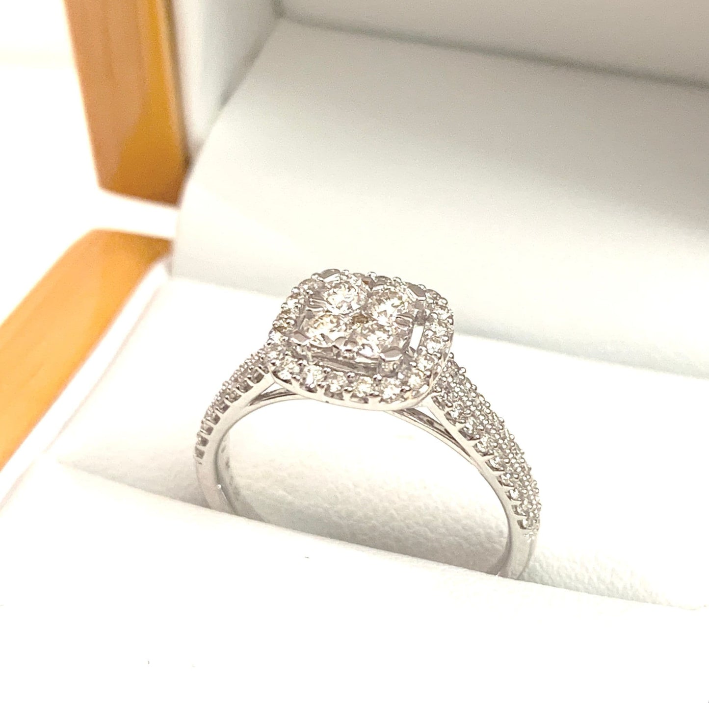 Cushion shaped diamond cluster ring engagement white gold