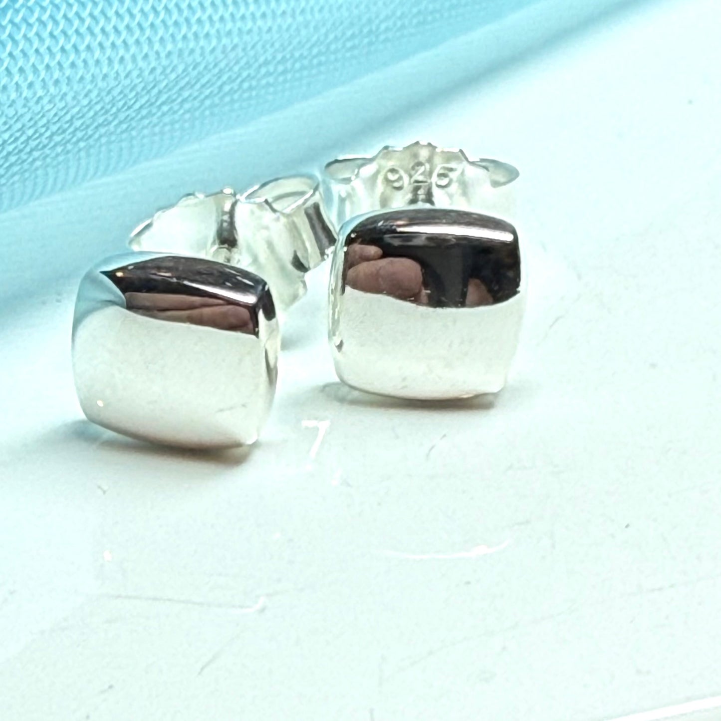 Cushion shaped sterling silver stud earrings polished
