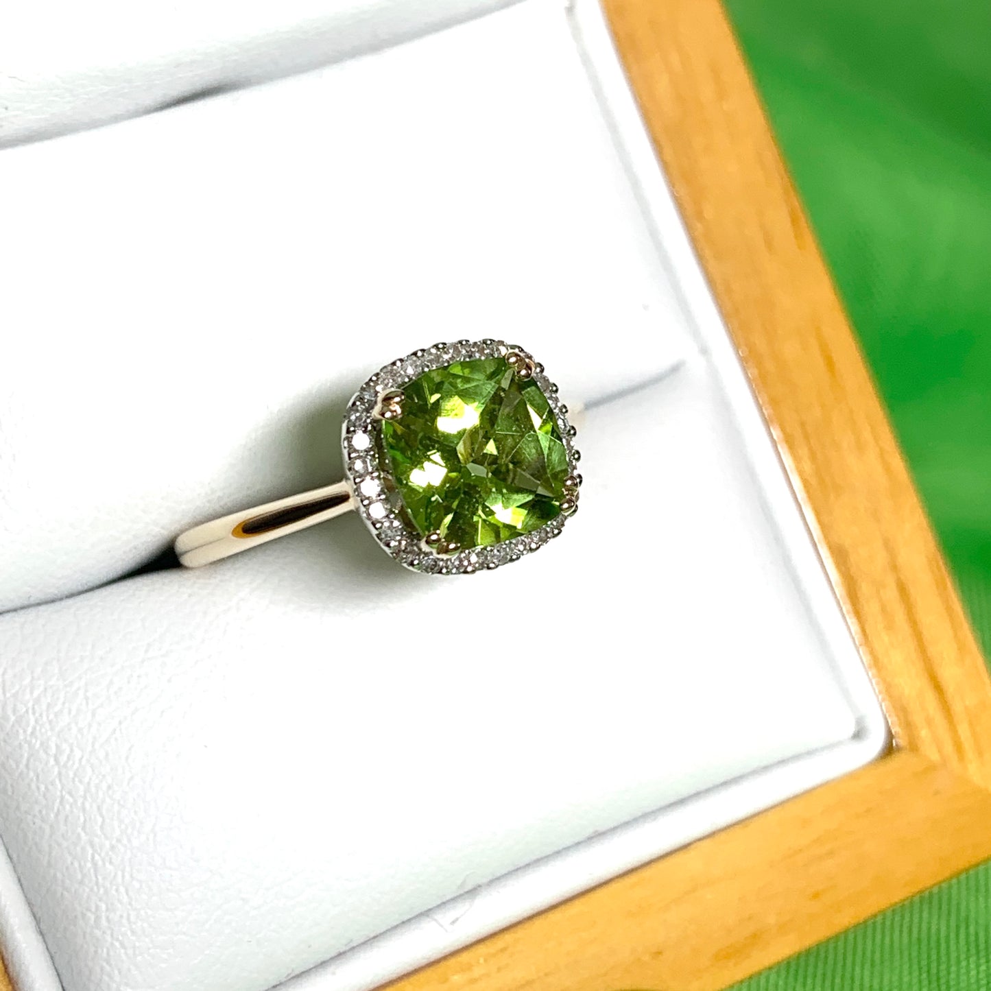 Cushion shaped yellow gold green peridot and diamond cluster ring