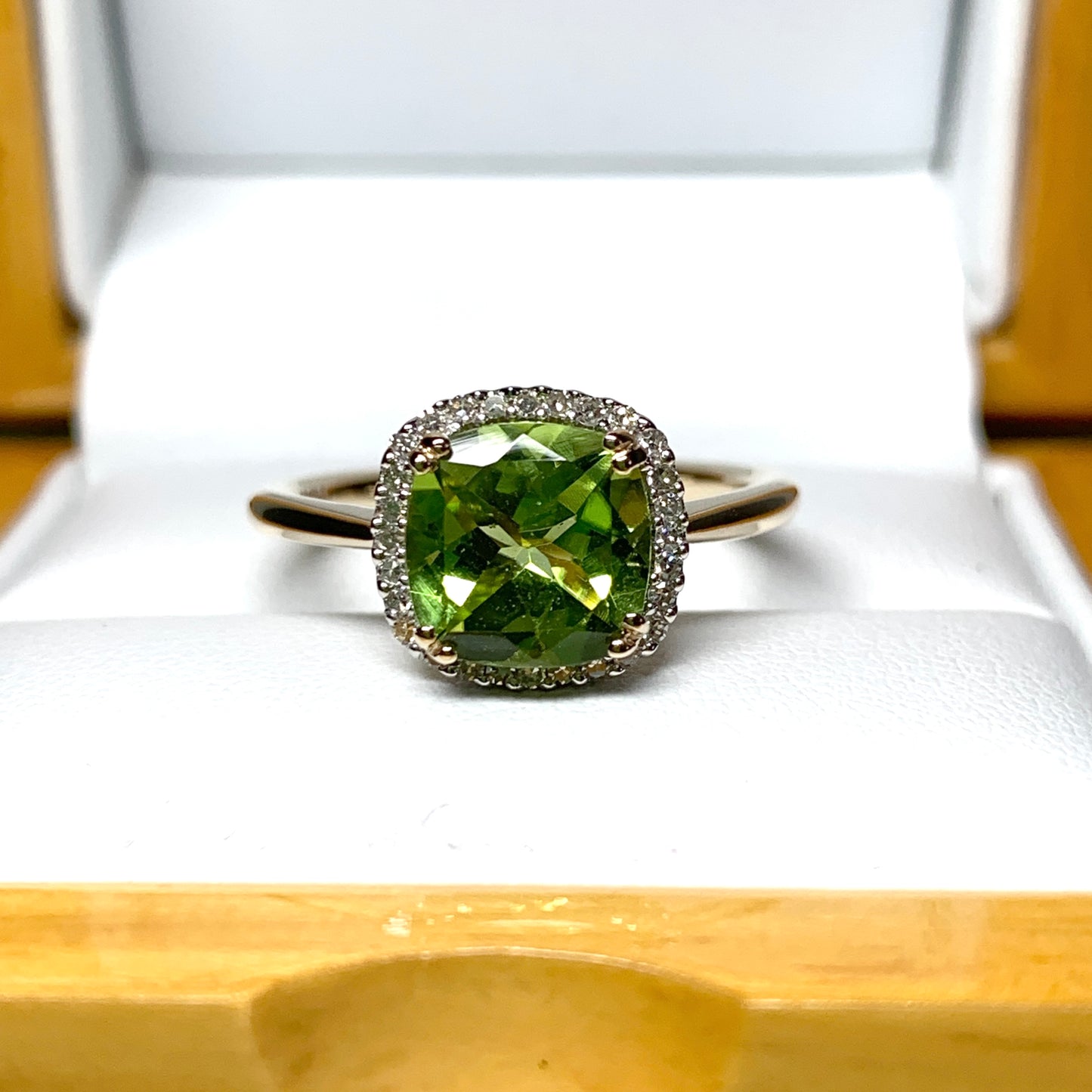 Cushion shaped yellow gold green peridot and diamond cluster ring