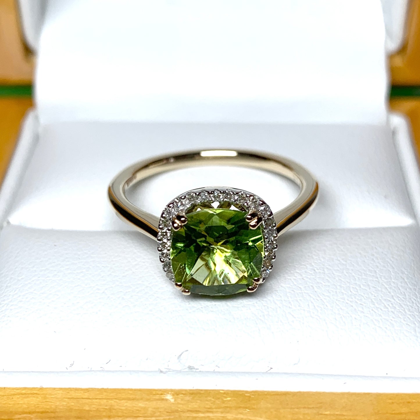 Cushion shaped yellow gold green peridot and diamond cluster ring