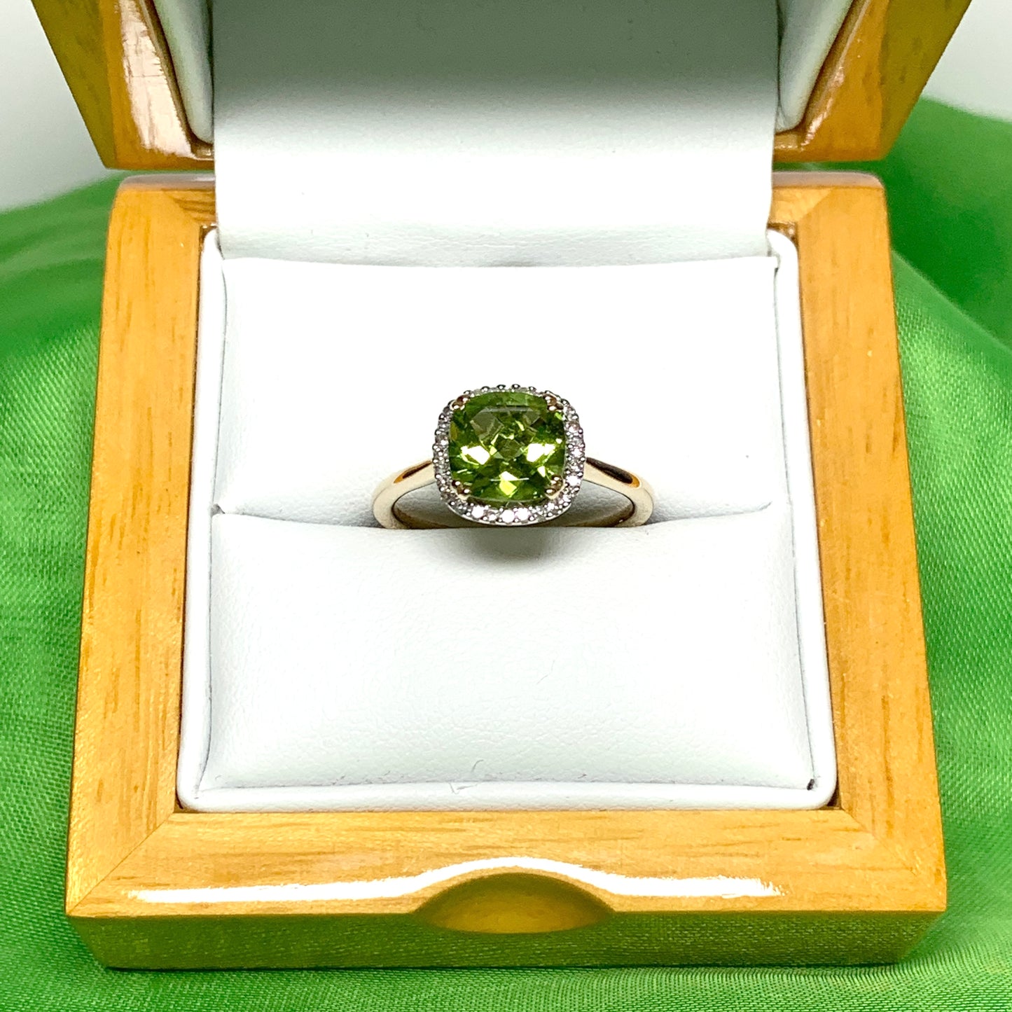 Cushion shaped yellow gold green peridot and diamond cluster ring