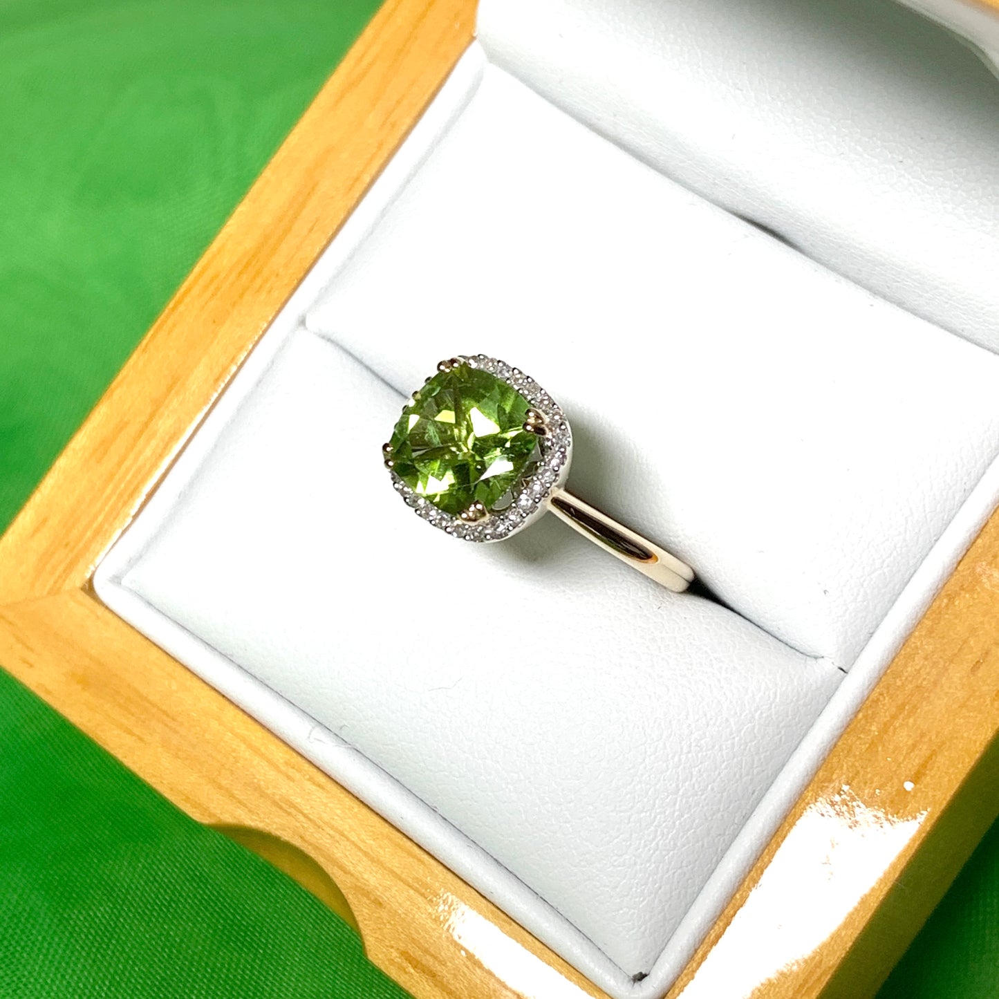 Cushion shaped yellow gold green peridot and diamond cluster ring