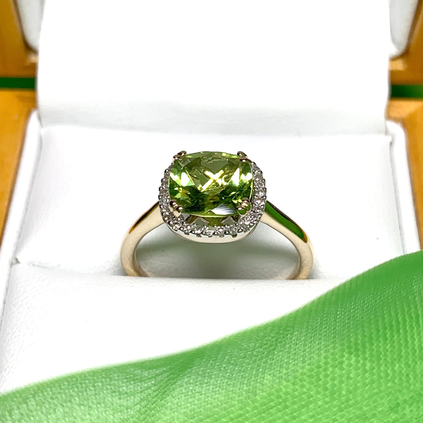 Cushion shaped yellow gold green peridot and diamond cluster ring