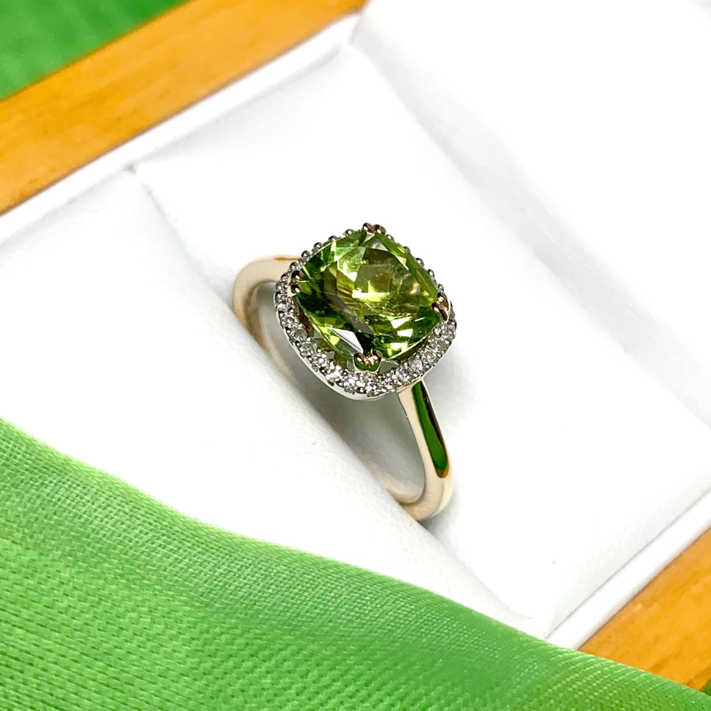 Cushion shaped yellow gold green peridot and diamond cluster ring