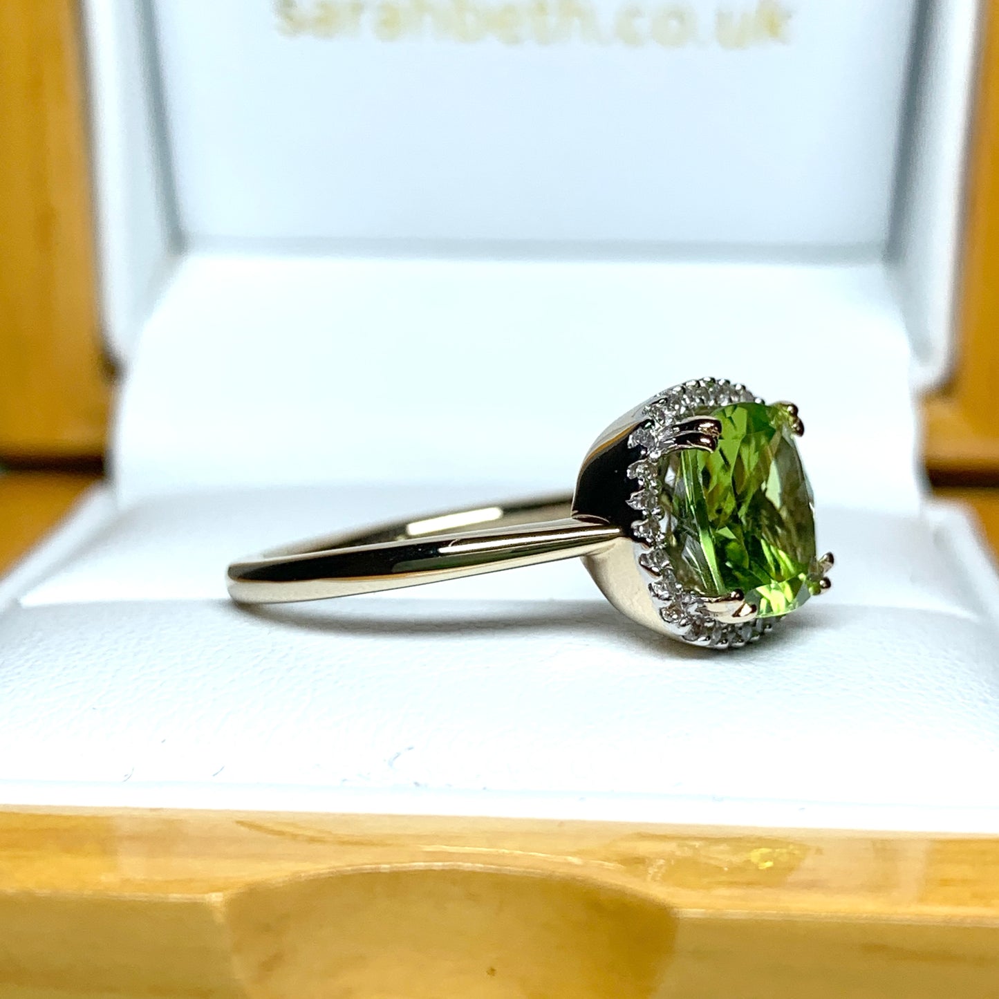 Cushion shaped yellow gold green peridot and diamond cluster ring