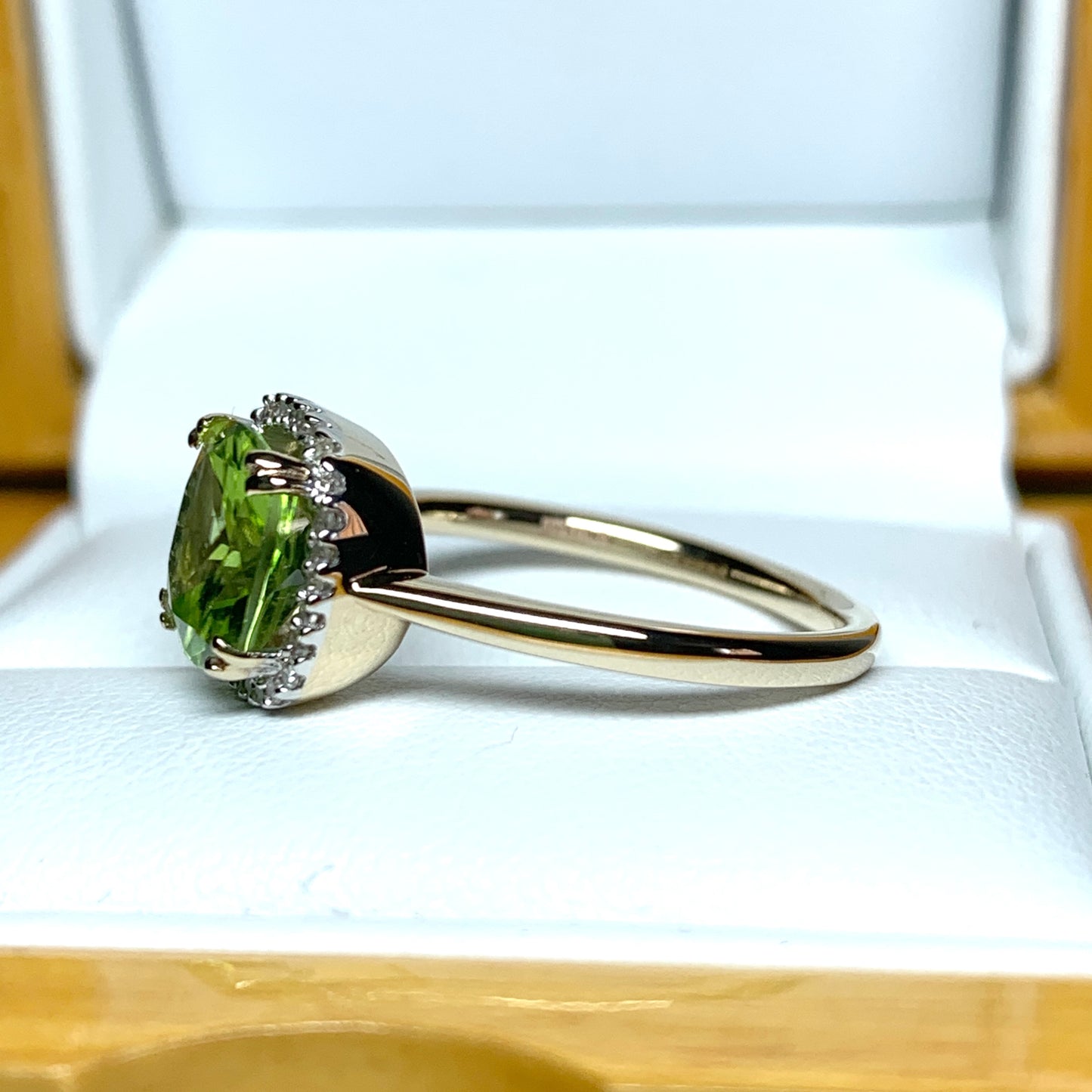 Cushion shaped yellow gold green peridot and diamond cluster ring