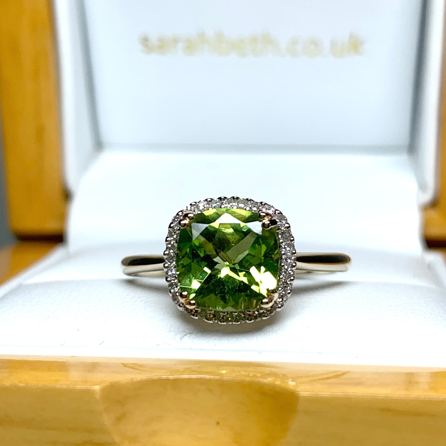 Cushion shaped yellow gold green peridot and diamond cluster ring