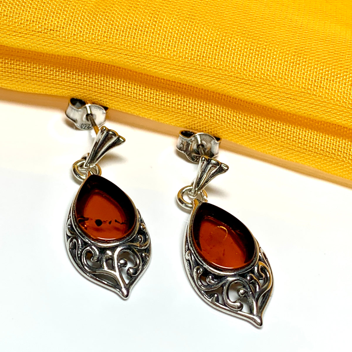 Earrings real amber drop earrings with a scrolled pattern sterling silver