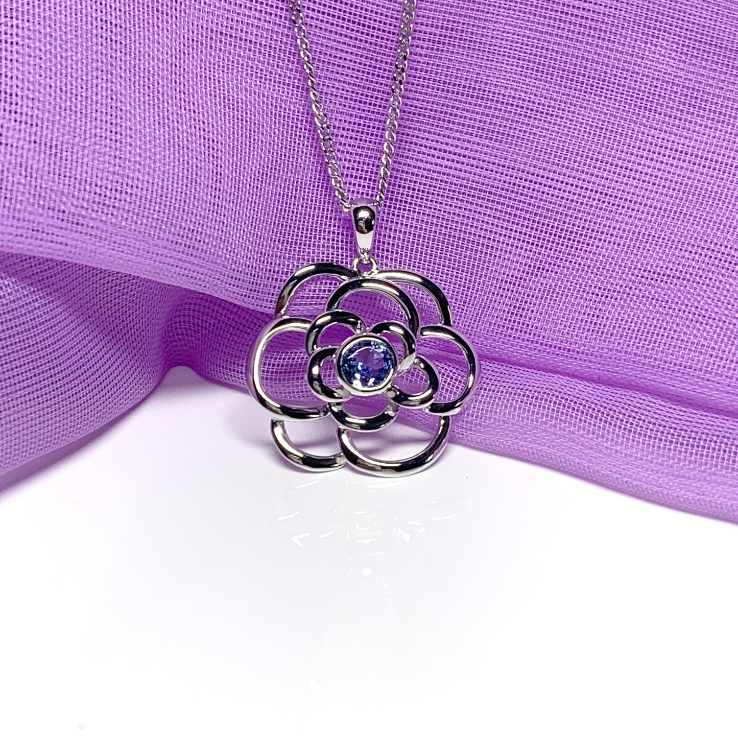 Real tanzanite round swirl necklace made in white gold