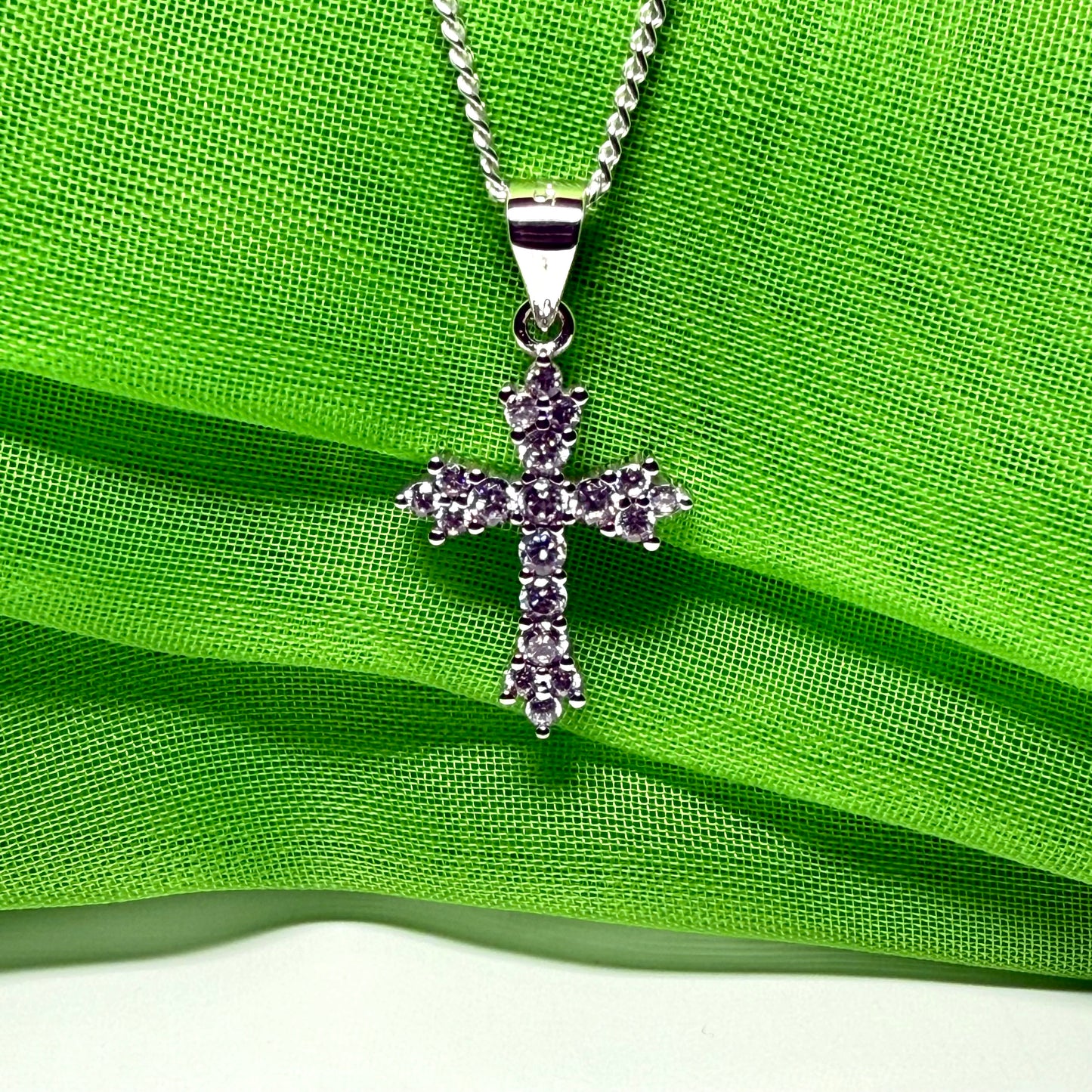 Fancy cubic zirconia set sterling silver cross with a chain