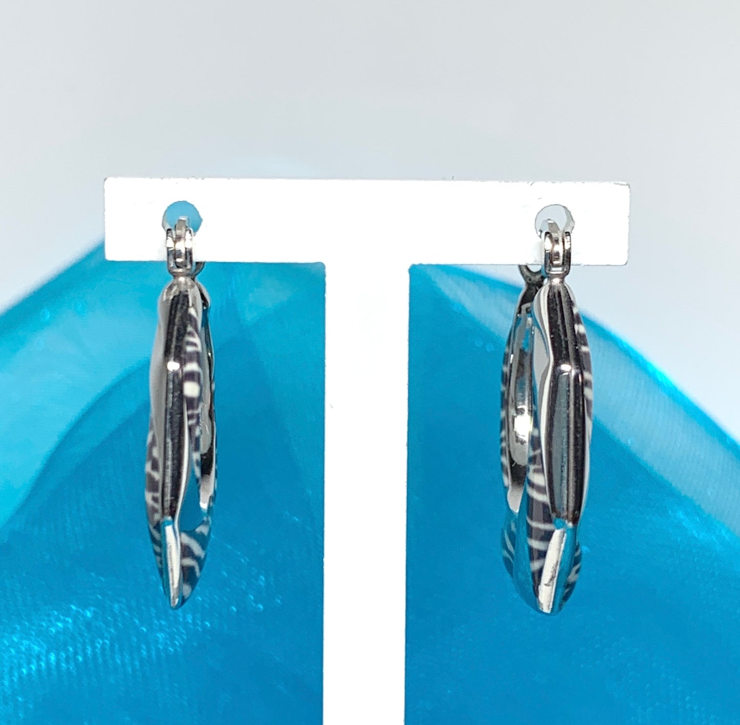 Fancy zebra patterned enamelled sterling silver octagonal hoop earrings