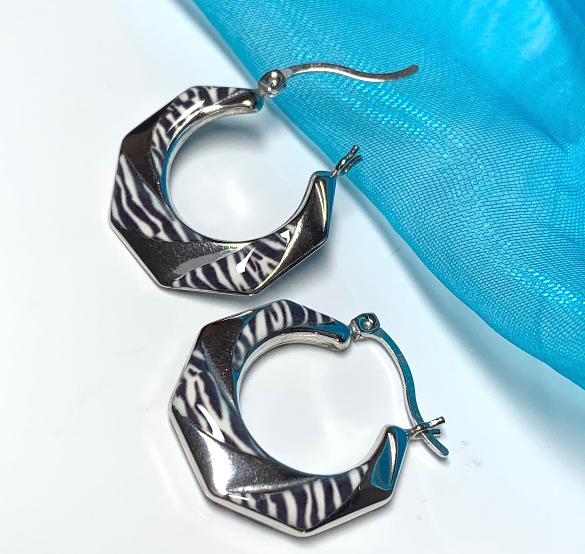 Fancy zebra patterned enamelled sterling silver octagonal hoop earrings