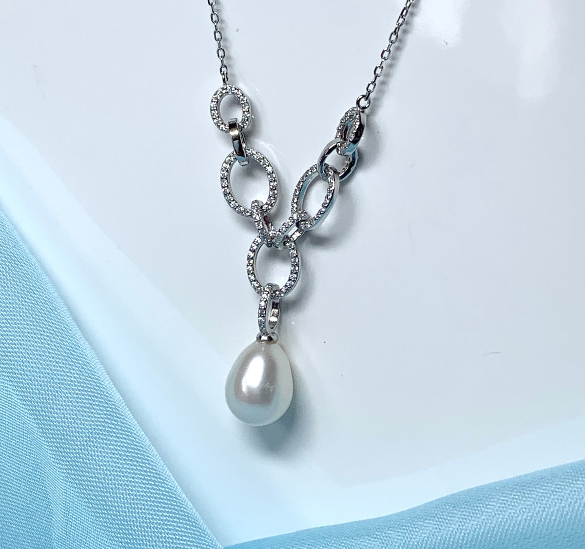 Real freshwater cultured pearl necklace chain links cubic zirconia stones above the pendant