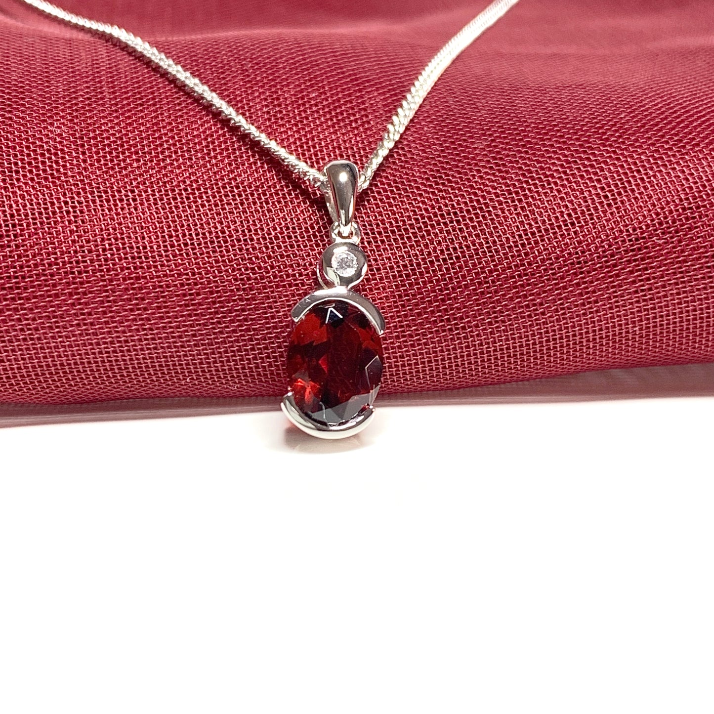 Oval garnet and cubic zirconia sterling silver necklace