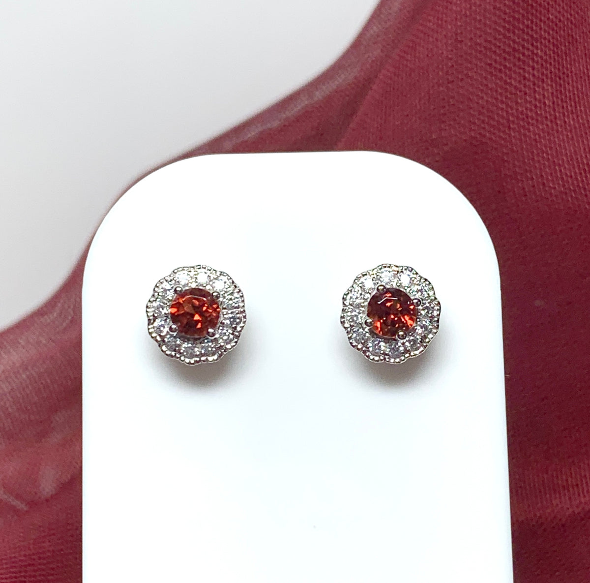 Garnet and cubic zirconia sterling silver round cluster stud earrings