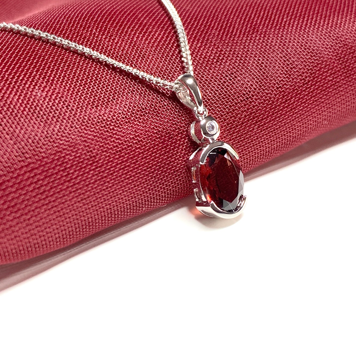 Oval garnet and cubic zirconia sterling silver necklace