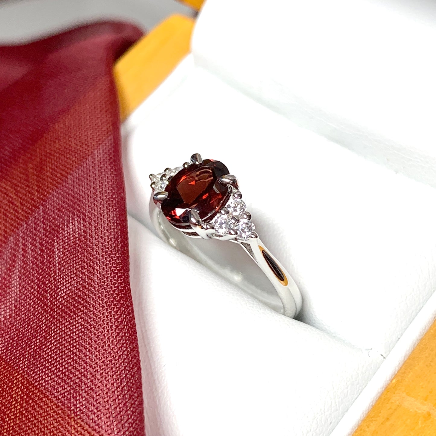 Garnet and cubic zirconia sterling silver oval dress ring