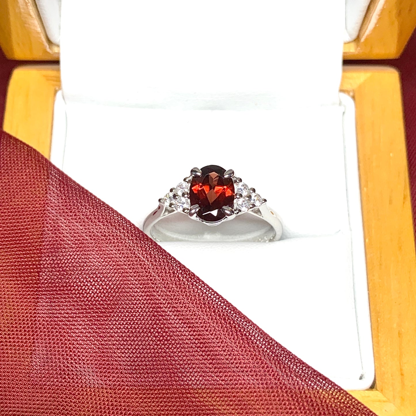 Garnet and cubic zirconia sterling silver oval dress ring