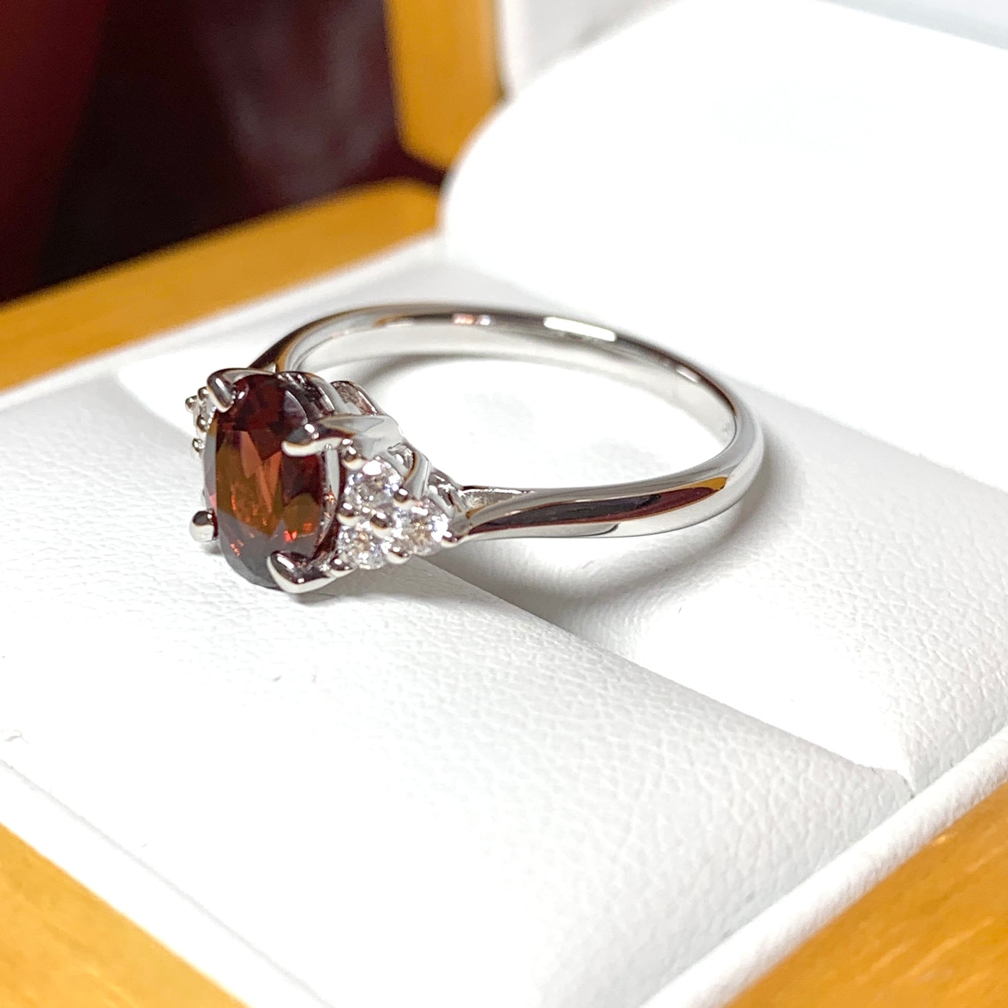 Garnet and cubic zirconia sterling silver oval dress ring