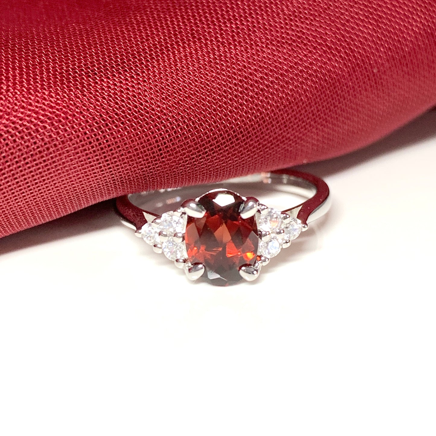 Garnet and cubic zirconia sterling silver oval dress ring