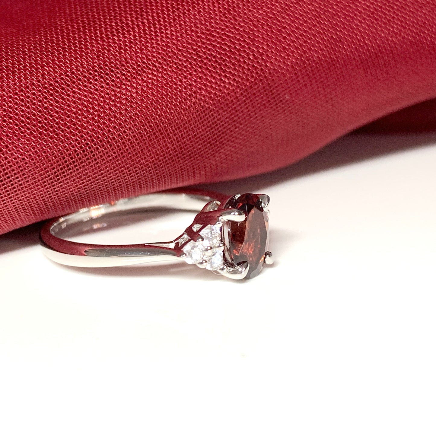 Garnet and cubic zirconia sterling silver oval dress ring