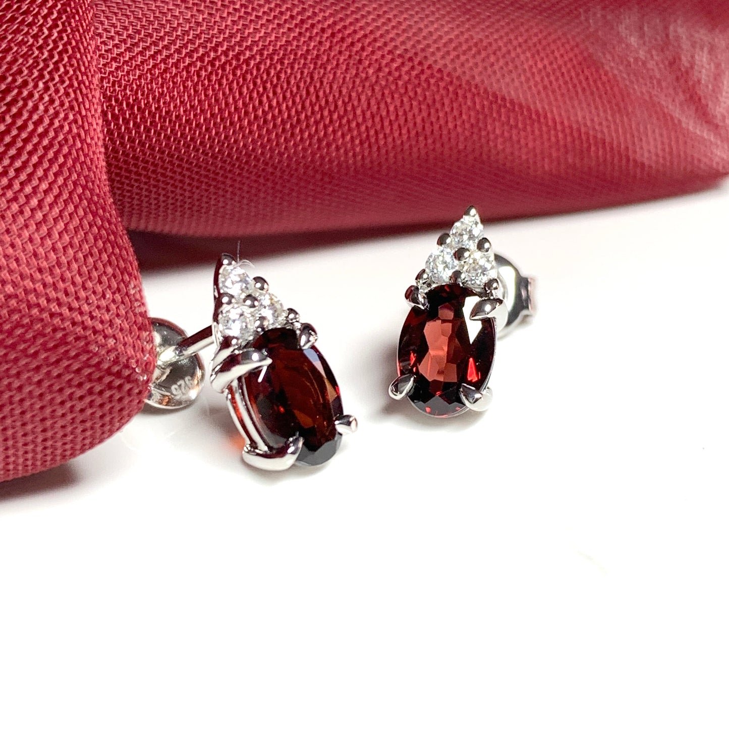 Garnet and cubic zirconia sterling silver oval earrings