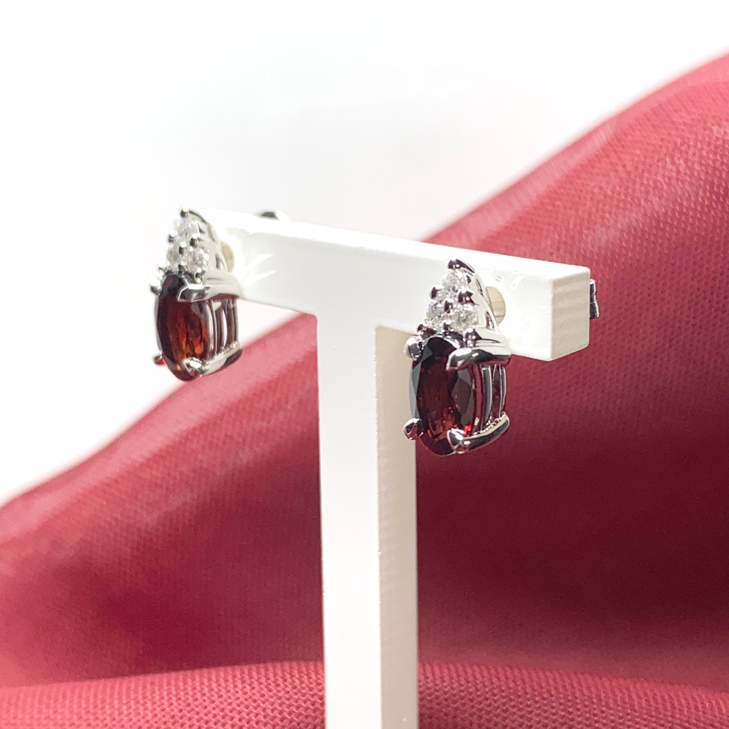 Garnet and cubic zirconia sterling silver oval earrings