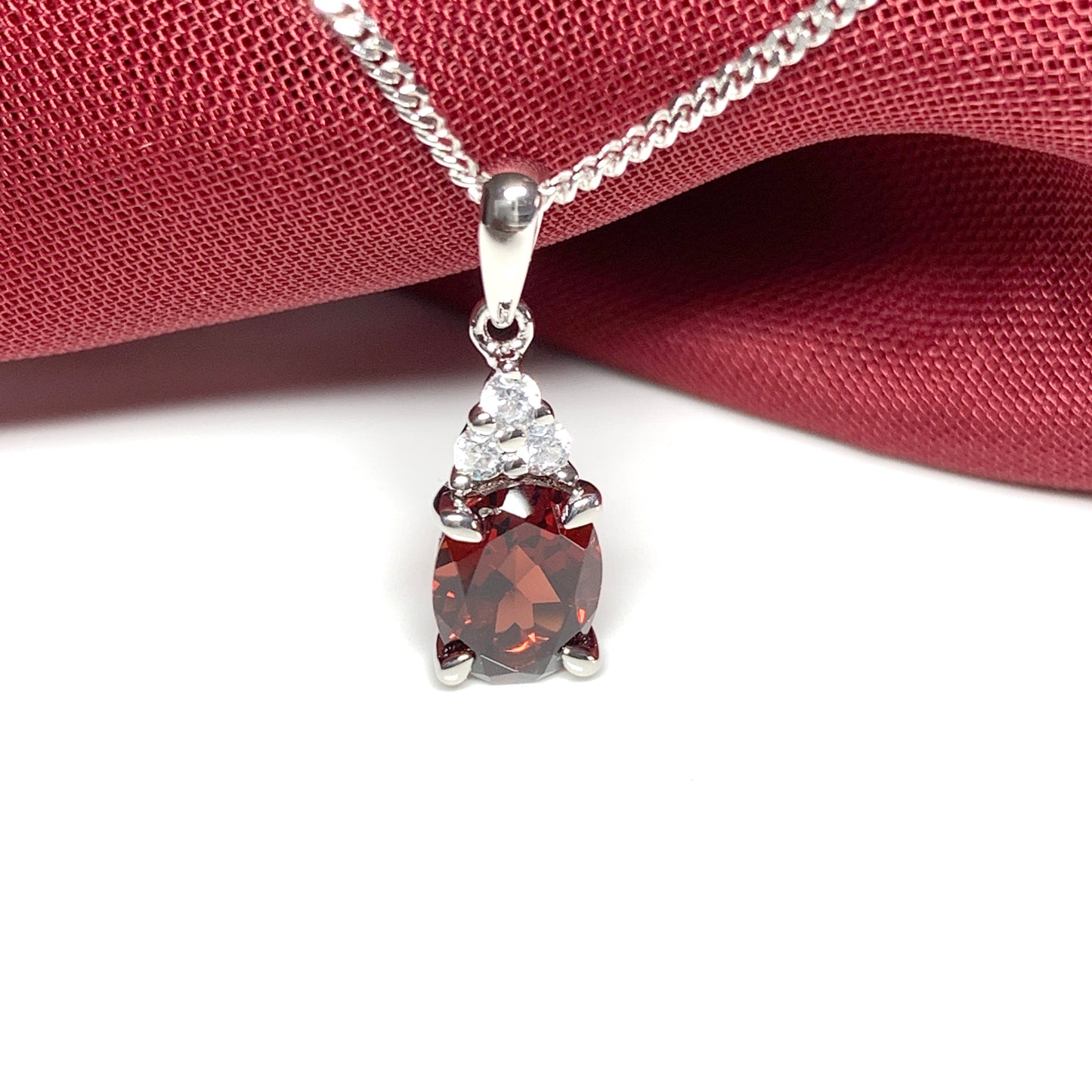 Garnet and cubic zirconia sterling silver oval necklace