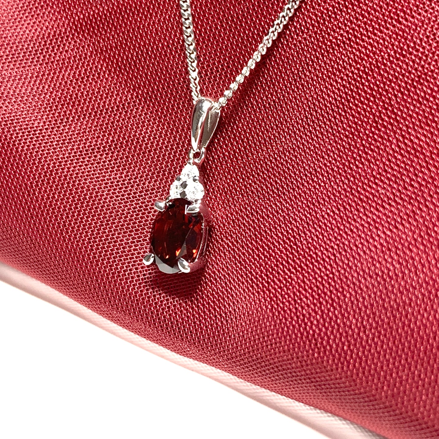 Garnet and cubic zirconia sterling silver oval necklace