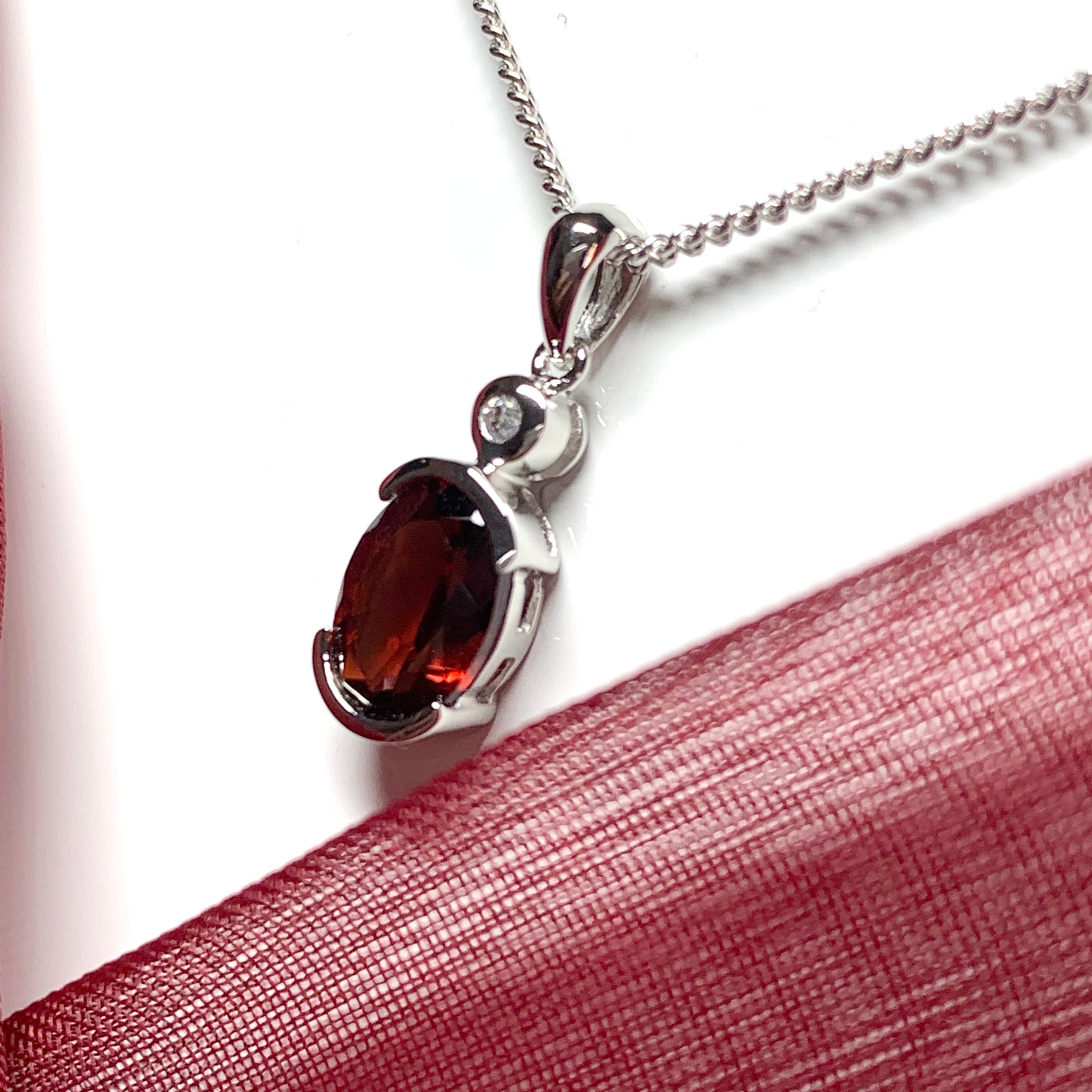 Oval garnet and cubic zirconia sterling silver necklace