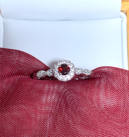 Garnet and cubic zirconia sterling silver round dress cluster ring