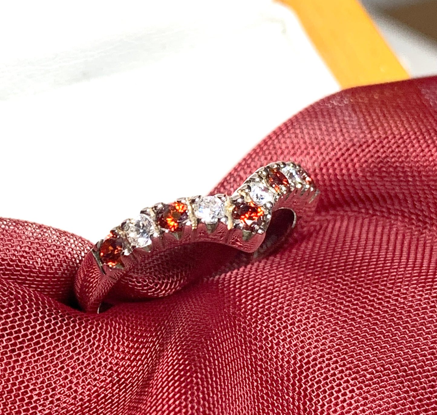 Garnet coloured wishbone ring sterling silver with cubic zirconia stones