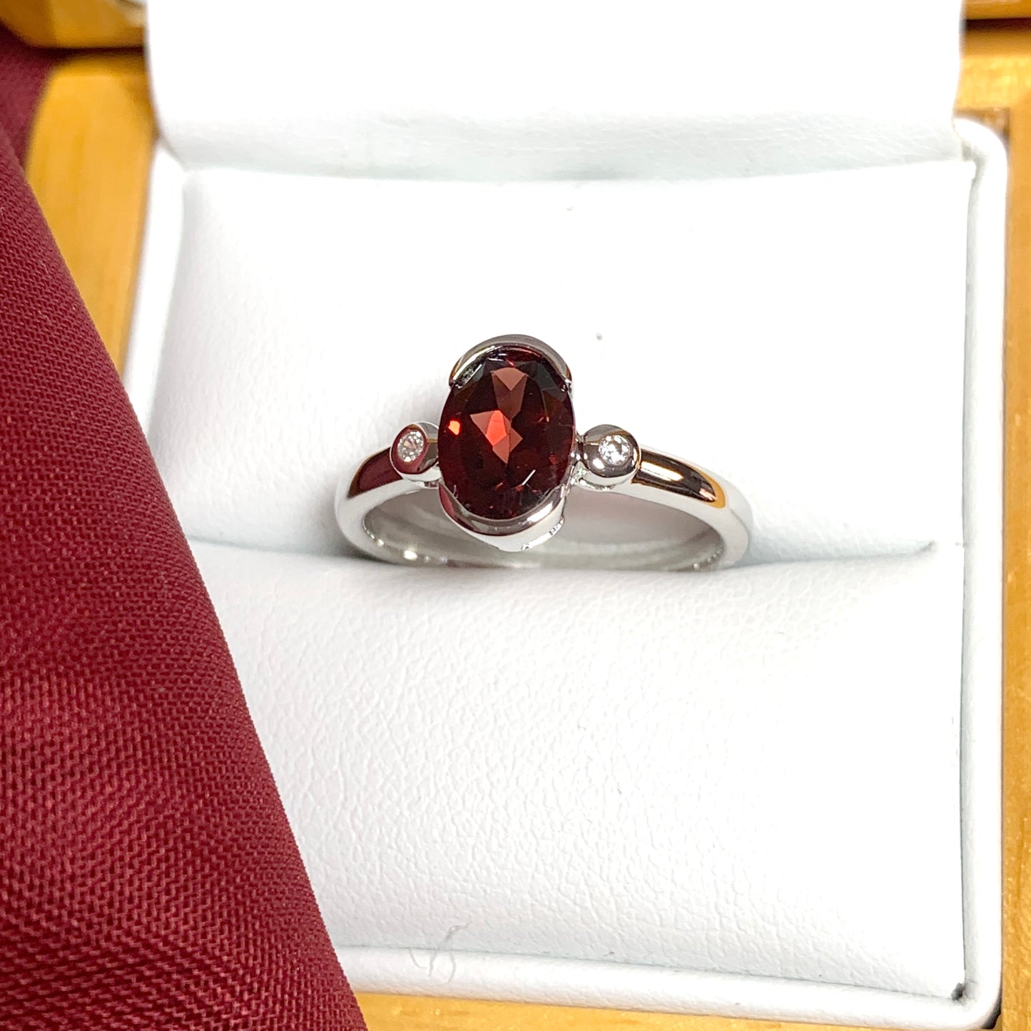 Oval garnet and cubic zirconia sterling silver ring