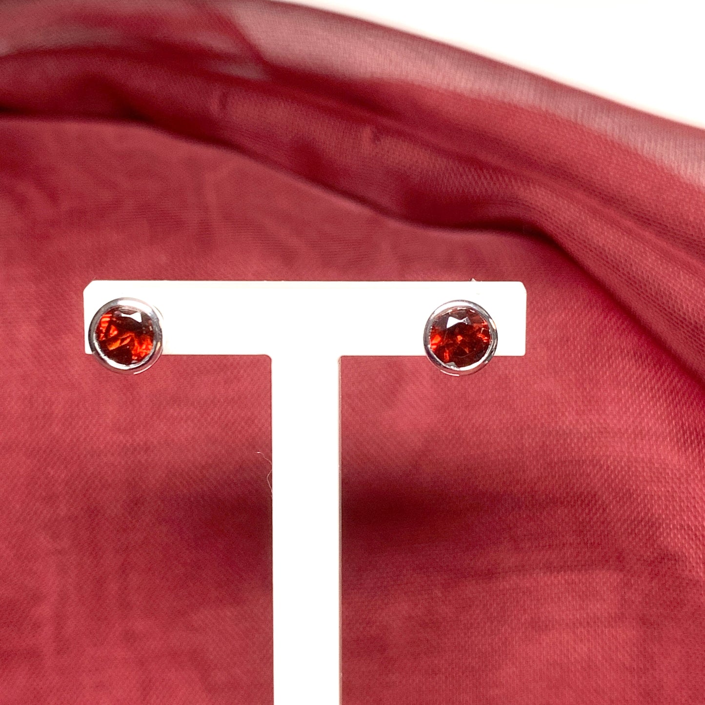 Garnet silver round stud earrings smooth rubbed over setting