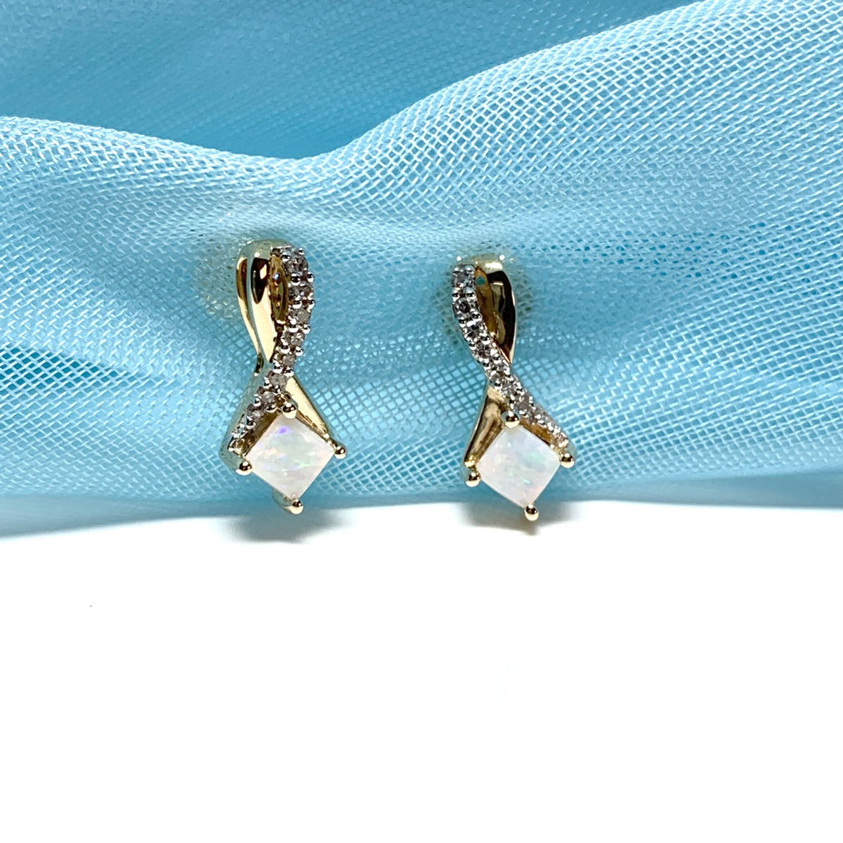 Gold opal and diamond stud earrings