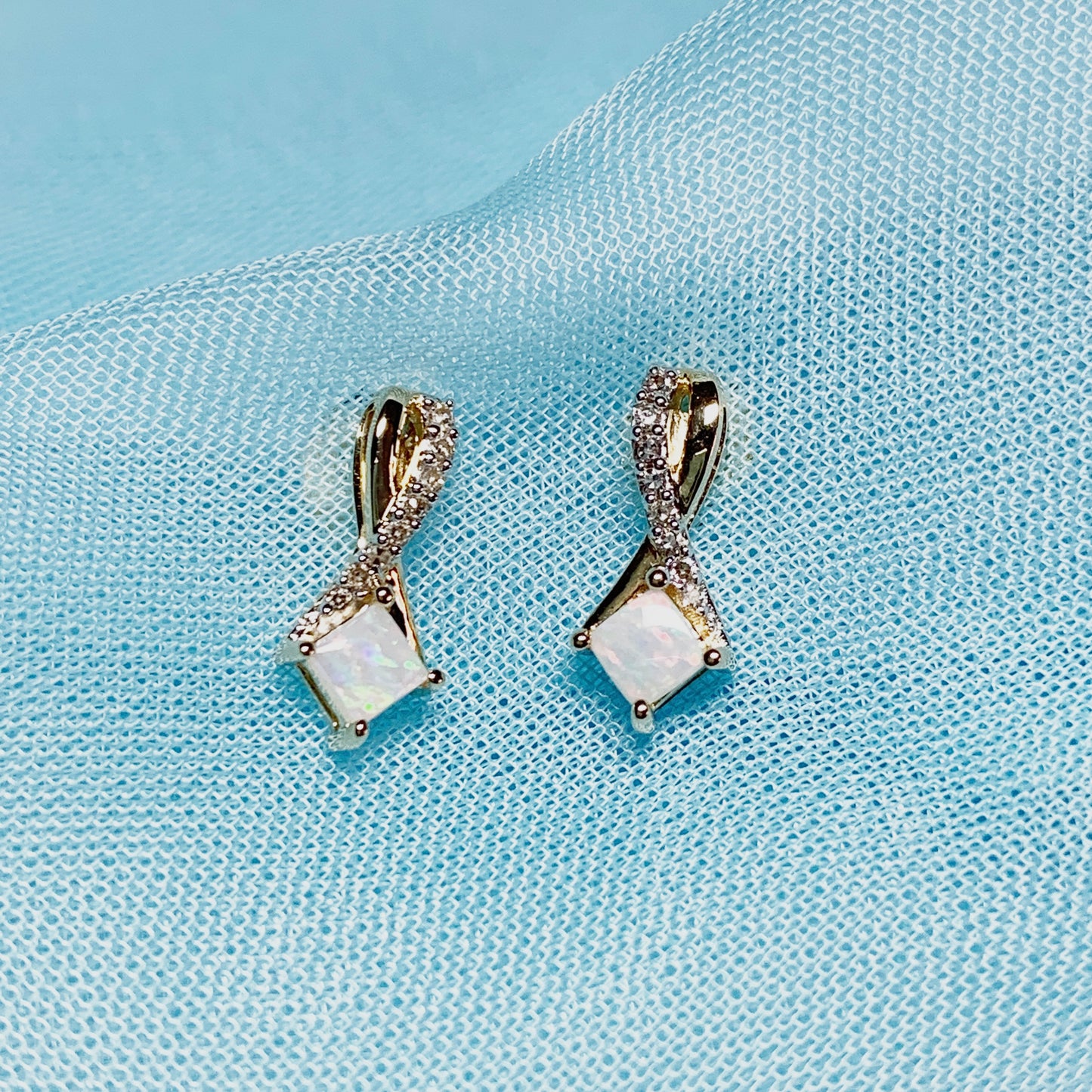 Gold opal and diamond stud earrings