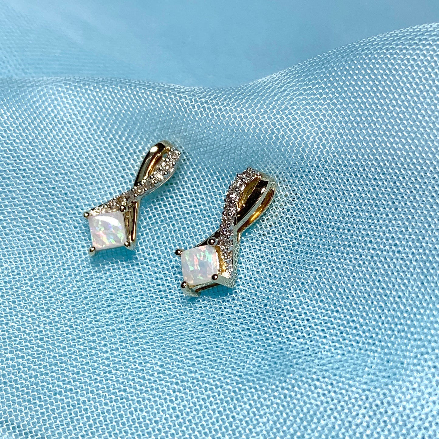 Gold opal and diamond stud earrings