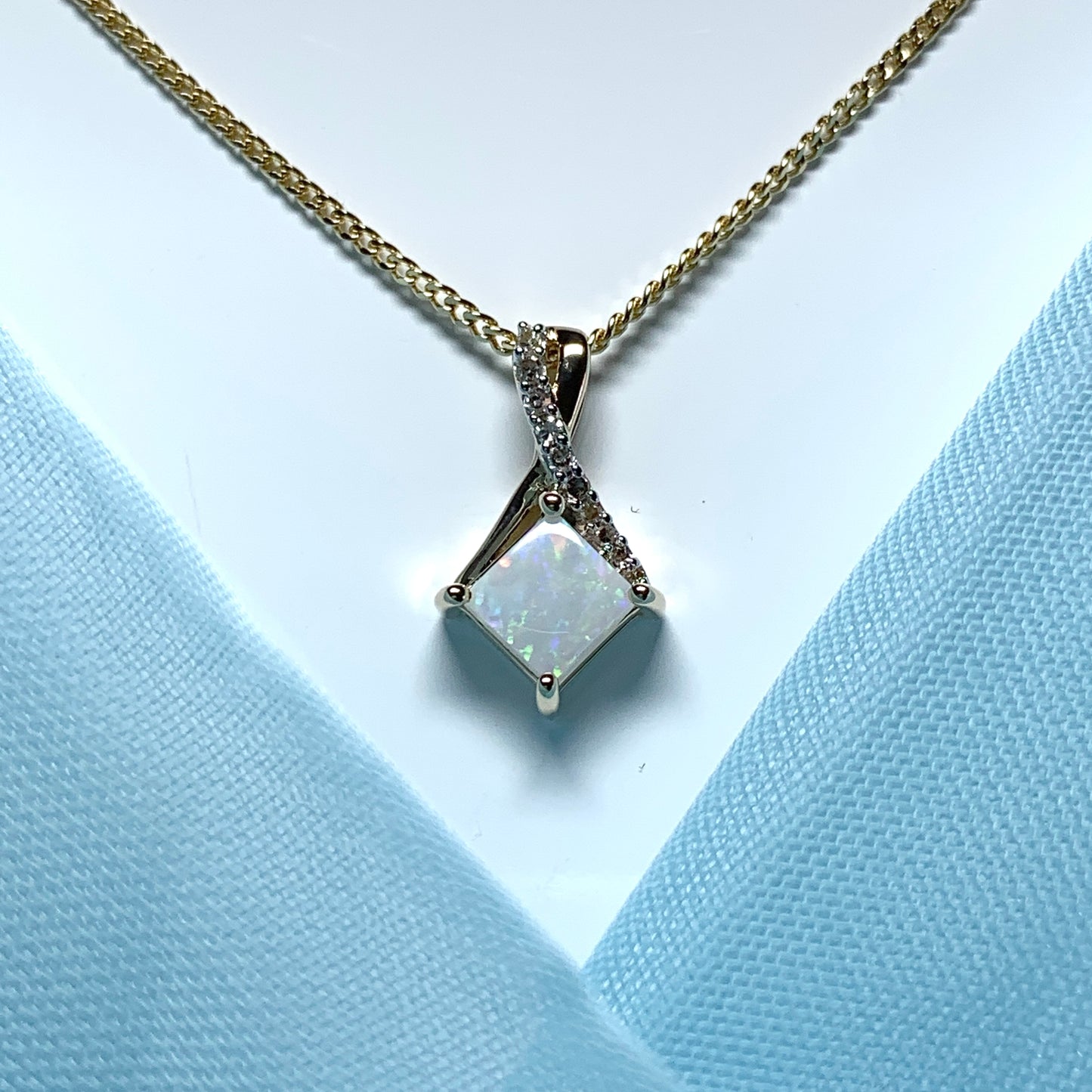 Gold opal and diamond necklace pendent