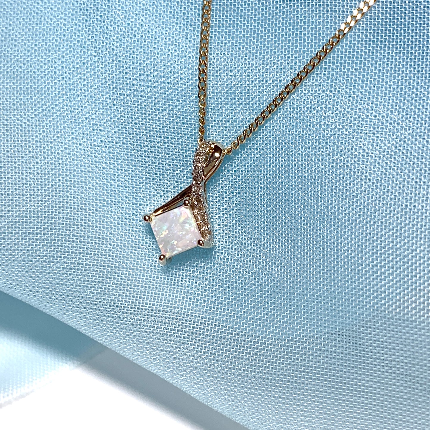 Gold opal and diamond necklace pendent