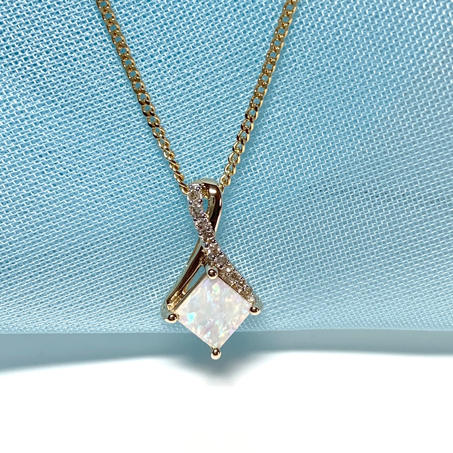 Gold opal and diamond necklace pendent